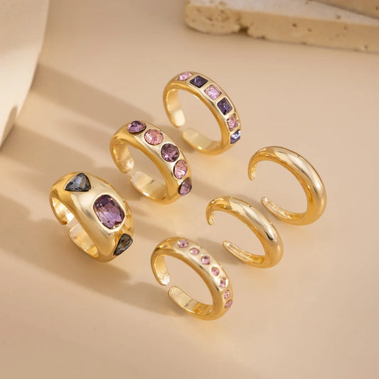 Set van 6 Goudkleurige Ringen met Paarse Zirkoon – Verstelbaar & Luxe Afwerking