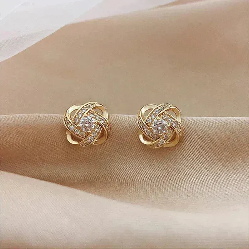 Vanmeeren™ | Gouden spiralen oorbellen met kristallen
