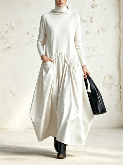 Vanmeeren™ | Celinne – Lange Zwarte Oversized Jurk met Hoge Hals en Decoratieve Zakken
